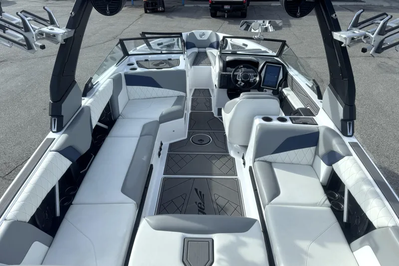 Slide: The Image of 2022 Tigé Z3 boat interior with luxurious seating and modern dashboard design. - 7