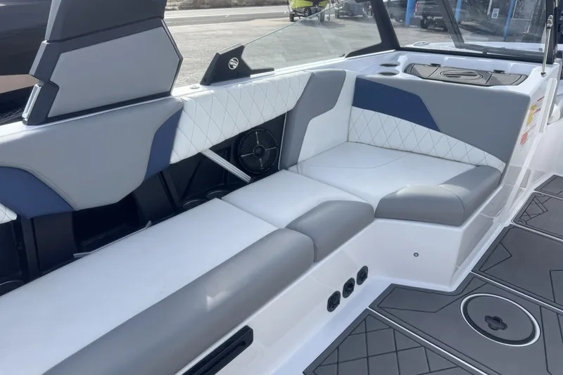 Slide: The Image of 2022 Tigé Z3 boat interior with gray and white seating, modern design. - 8