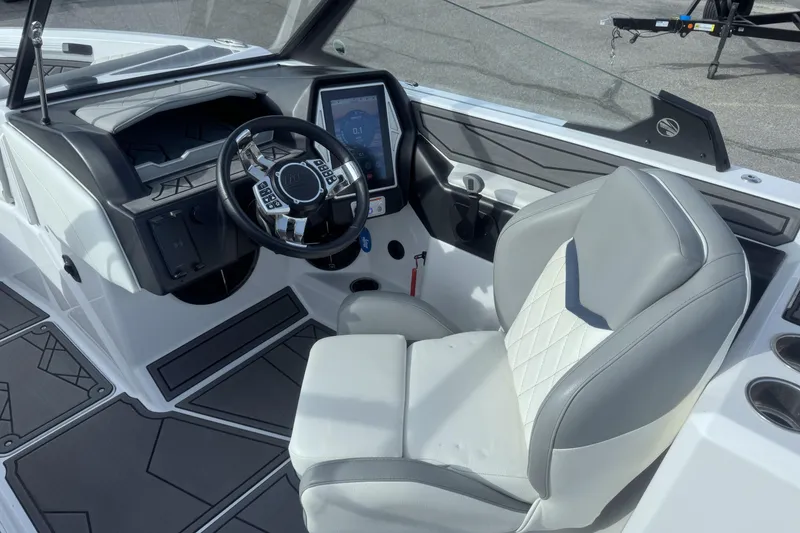 Slide: The Image of 2022 Tigé Z3 boat interior with modern dashboard and comfortable seating. - 9