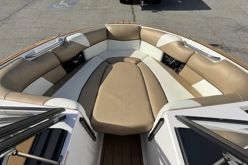 Slide: The Image of 2022 Moomba Craz boat interior with beige and white cushioned seating. - 13