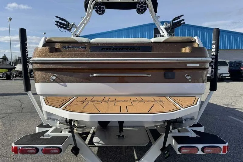 Slide: The Image of 2022 Moomba Craz boat rear view with teak deck and Raptor engine. - 7
