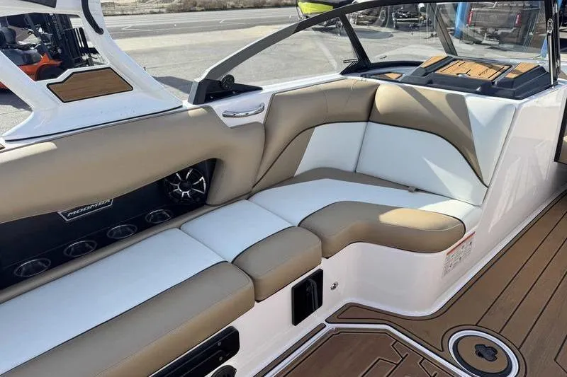 Slide: The Image of 2022 Moomba Craz boat interior with tan and white seating, featuring modern design elements. - 8