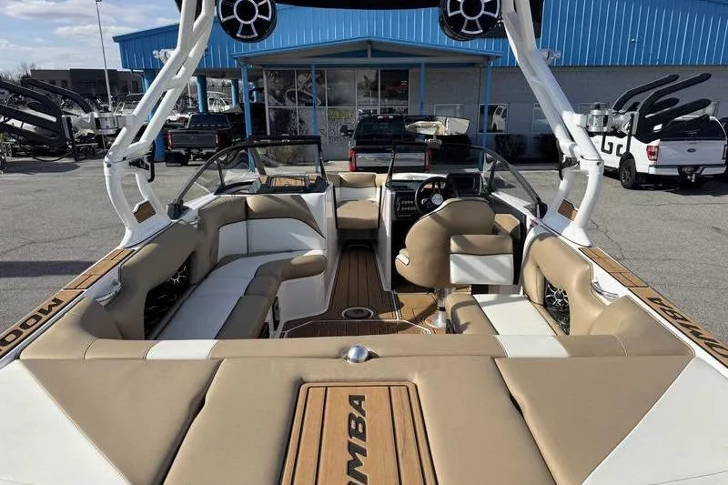 Slide: The Image of 2022 Moomba Craz boat interior with tan seating and modern design. - 9