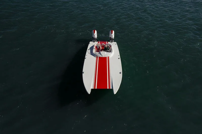Slide: The Image of 2022 HellKats 32 powerboat with red stripe on open water. - 17