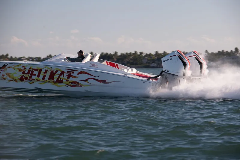Slide: The Image of 2022 HellKats 32 speedboat racing on water with powerful engines and vibrant graphics. - 9