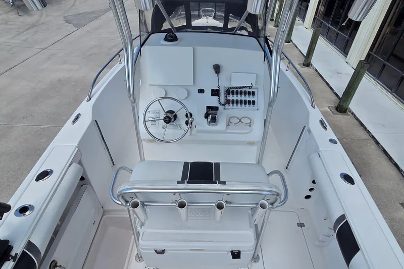 Slide: The Image of 2008 Pro-Line 24 Super Sport boat cockpit with steering wheel and control panel. - 16