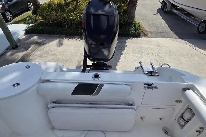 Slide: The Image of 2008 Pro-Line 24 Super Sport boat with outboard motor and seating area. - 4