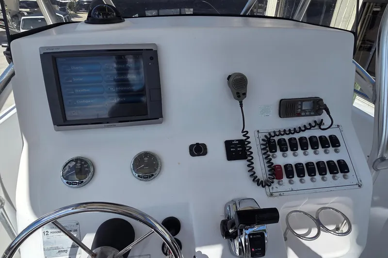 Slide: The Image of Control panel of 2008 Pro-Line 24 Super Sport boat with navigation and communication equipment. - 6