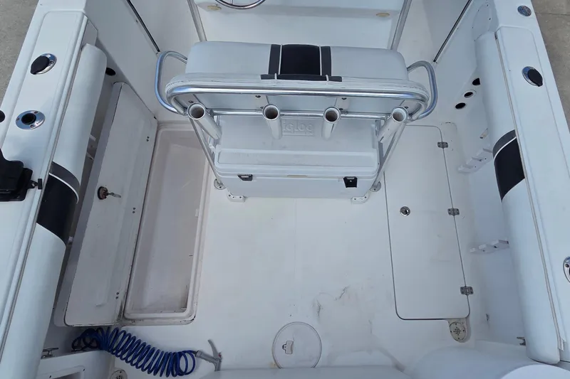 Slide: The Image of 2008 Pro-Line 24 Super Sport boat interior with seating and storage compartments. - 7