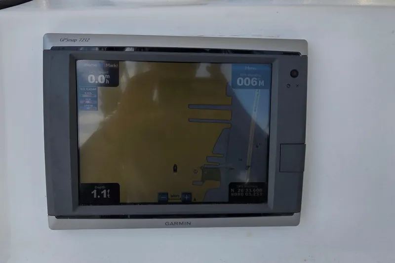 Slide: The Image of Garmin GPSMap 7212 on 2008 Pro-Line 24 Super Sport boat dashboard. - 8