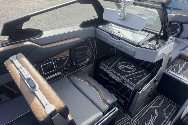 Slide: The Image of 2025 Tigé Ultré 25ZX boat interior with modern seating and sleek design. - 14