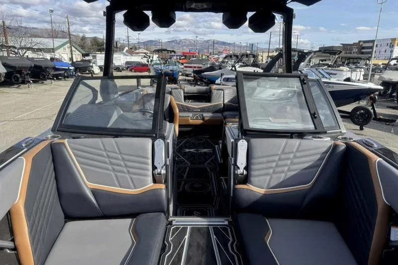 Slide: The Image of 2025 Tigé Ultré 25ZX boat interior with luxurious seating and modern design. - 16