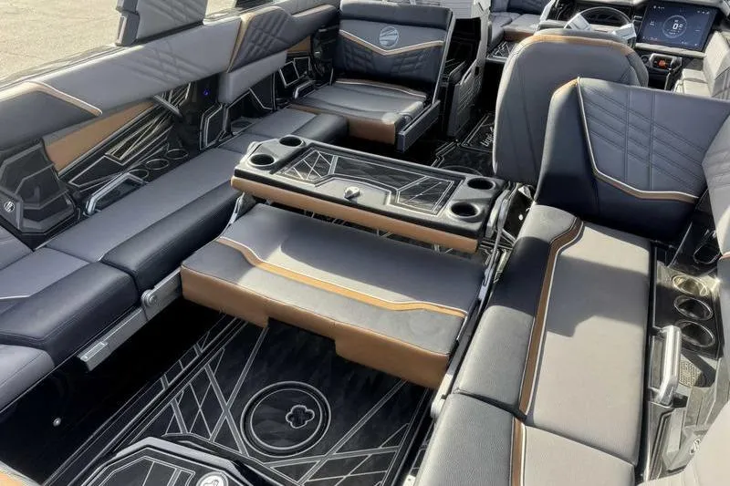 Slide: The Image of 2025 Tigé Ultré 25ZX boat interior with luxurious seating and modern design. - 17