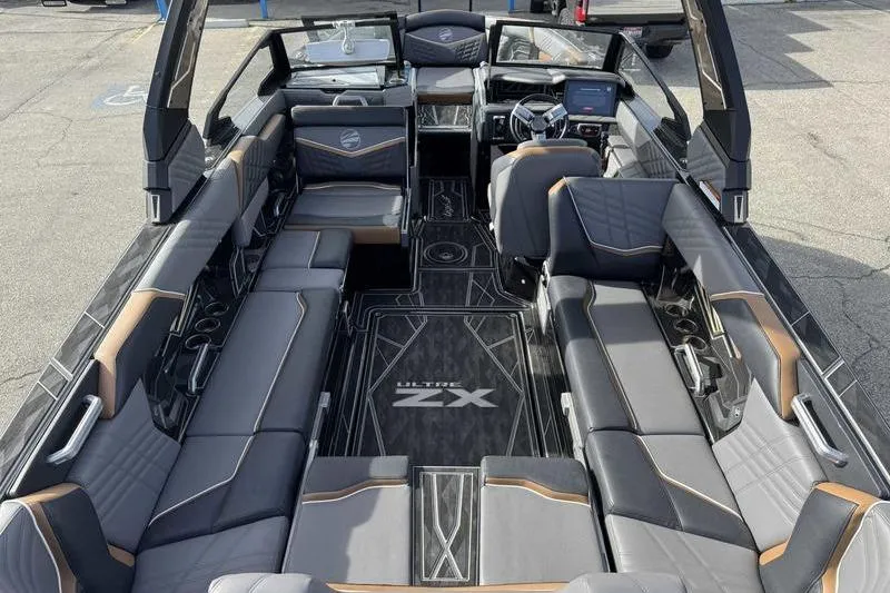 Slide: The Image of 2025 Tigé Ultré 25ZX boat interior with luxurious seating and modern design. - 9