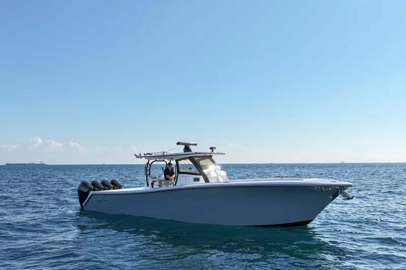 The Image of 2026 Blackwater 41 Sportfish boat cruising on open sea under clear blue sky. - 19