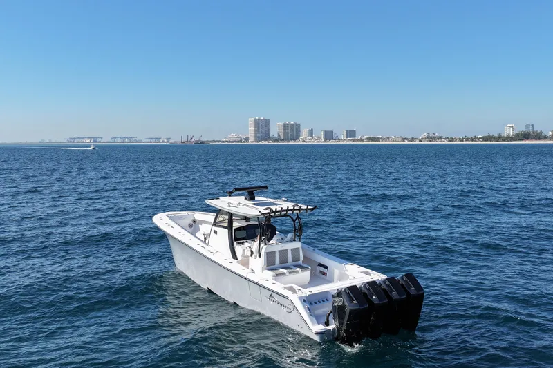 Slide: The Image of 2026 Blackwater 41 Sportfish boat on open water with city skyline in background. - 22