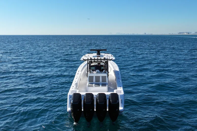 Slide: The Image of 2026 Blackwater 41 Sportfish boat on open ocean, rear view with multiple engines. - 23