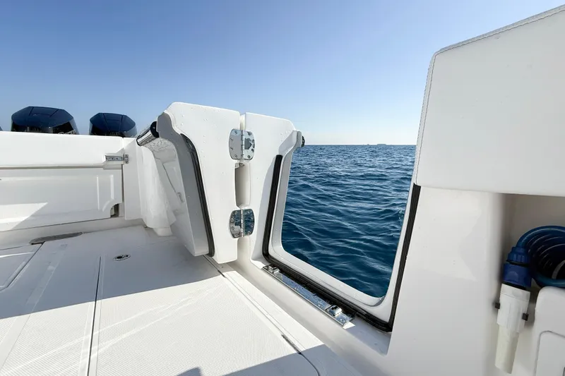 Slide: The Image of 2026 Blackwater 41 Sportfish boat with open side door, ocean view. - 31