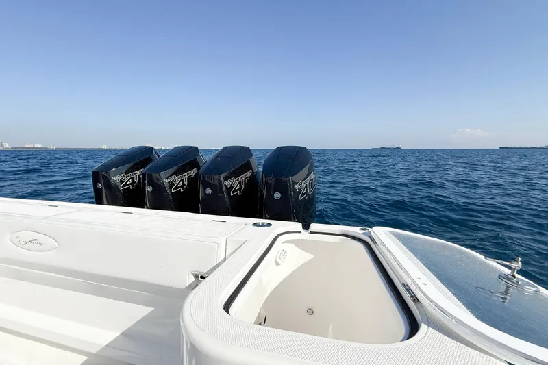 Slide: The Image of 2026 Blackwater 41 Sportfish boat with four powerful outboard engines on open sea. - 33