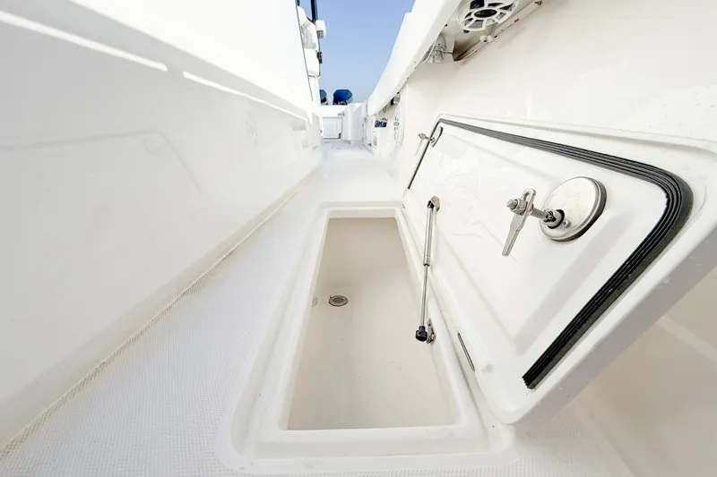 Slide: The Image of 2026 Blackwater 41 Sportfish boat storage compartment with open hatch and sleek design. - 34