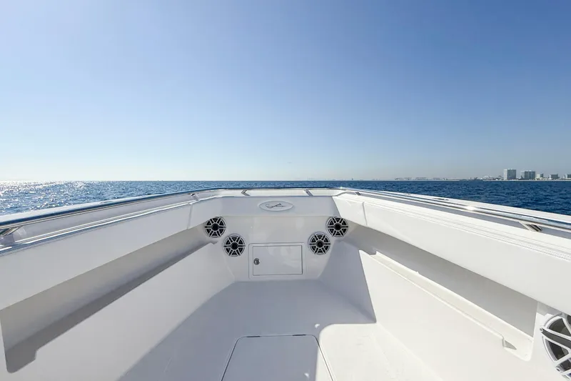 Slide: The Image of 2026 Blackwater 41 Sportfish boat, open deck view, cruising on calm ocean waters. - 36