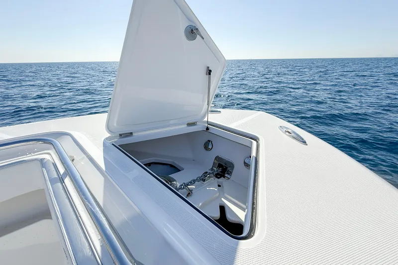 Slide: The Image of Open anchor compartment on 2026 Blackwater 41 Sportfish boat, ocean background. - 38
