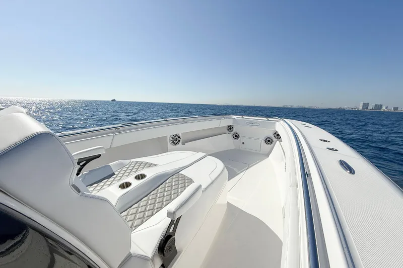 Slide: The Image of Luxurious 2026 Blackwater 41 Sportfish boat on open sea, featuring sleek white seating. - 42