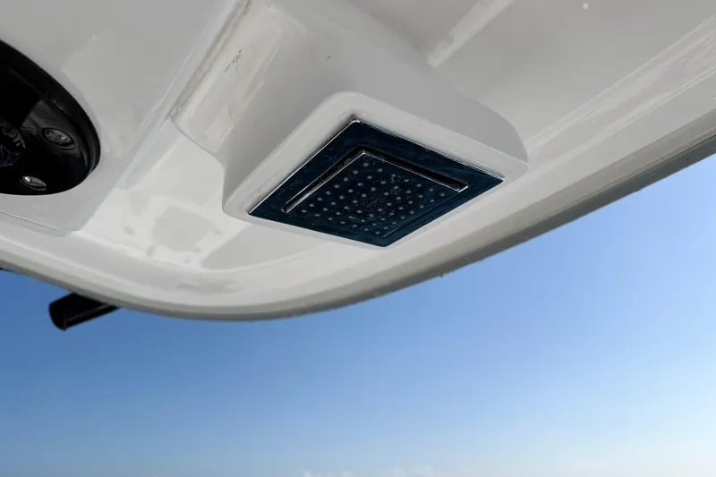 Slide: The Image of Close-up of 2026 Blackwater 41 Sportfish boat detail against clear blue sky. - 44