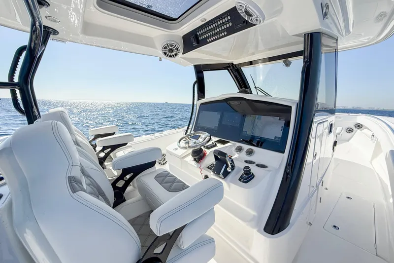Slide: The Image of 2026 Blackwater 41 Sportfish boat interior with modern helm and ocean view. - 45