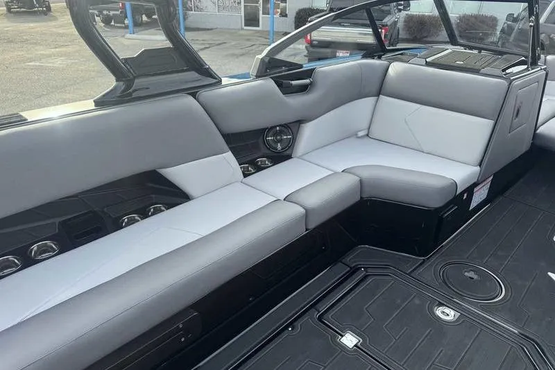 Slide: The Image of 2026 Moomba Tykon boat interior with sleek gray seating and modern design. - 11