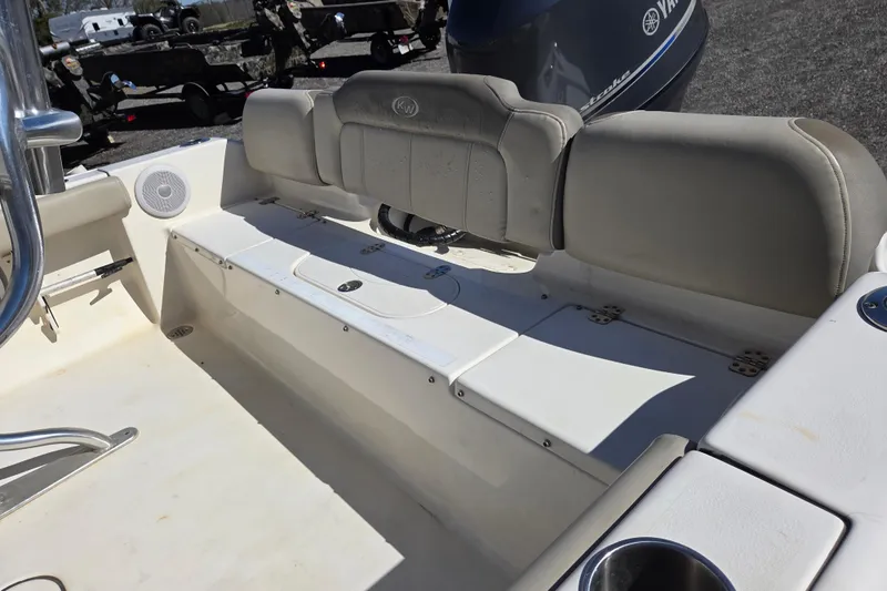 Slide: The Image of 2021 Key West 189 FS boat interior with seating and Yamaha engine. - 13