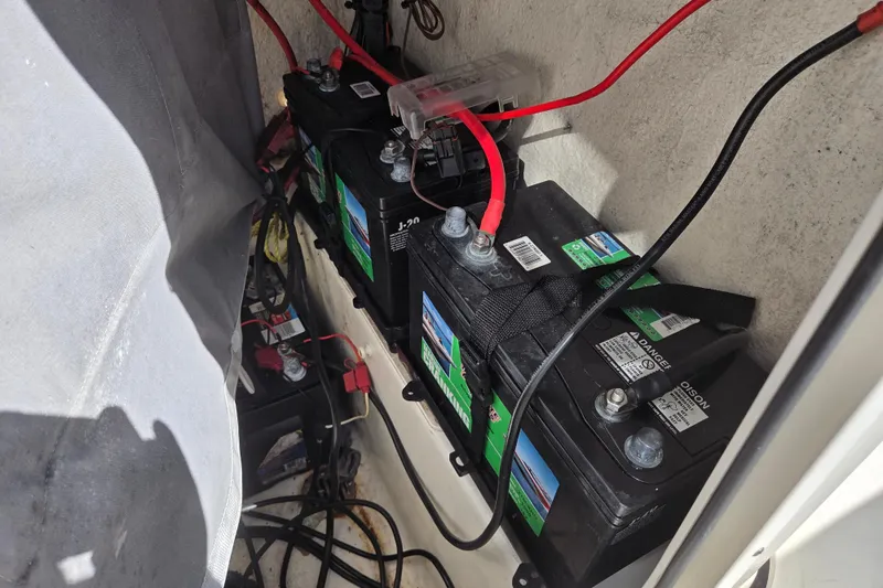 Slide: The Image of Batteries installed in a 2021 Key West 189 FS boat, with visible wiring connections. - 14