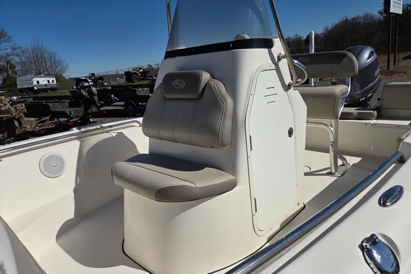 Slide: The Image of 2021 Key West 189 FS boat interior with seating and console, outdoor setting. - 17