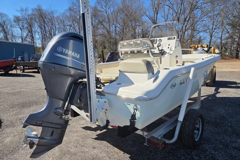Slide: The Image of 2021 Key West 189 FS boat with Yamaha outboard motor on a trailer. - 4