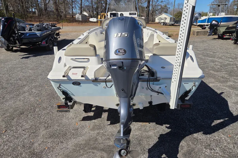Slide: The Image of 2021 Key West 189 FS boat with Yamaha 115 outboard motor, parked on gravel. - 5