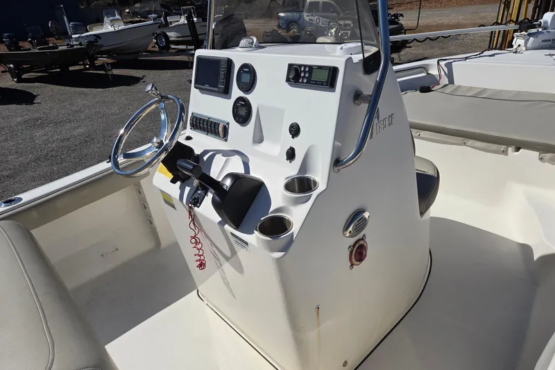 Slide: The Image of 2021 Key West 189 FS boat console with steering wheel and controls. - 9