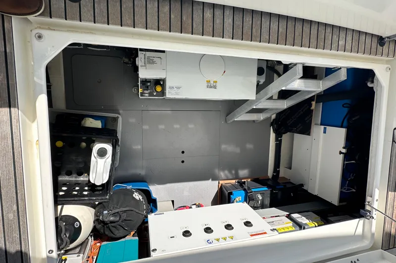 Slide: The Image of Engine room of 2021 Beneteau Swift Trawler 41 Fly, showcasing equipment and storage. - 19