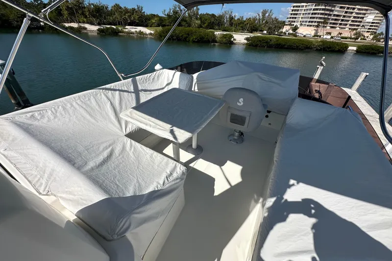 Slide: The Image of Flybridge of 2021 Beneteau Swift Trawler 41 Fly with seating and helm station. - 2