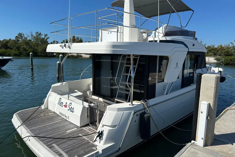 Slide: The Image of 2021 Beneteau Swift Trawler 41 Fly docked at marina, rear view. - 26