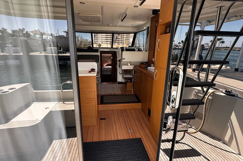 Slide: The Image of Interior view of 2021 Beneteau Swift Trawler 41 Fly, showcasing modern design and wood finishes. - 30