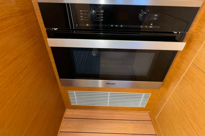 Slide: The Image of Modern kitchen appliance on 2021 Beneteau Swift Trawler 41 Fly yacht. - 32