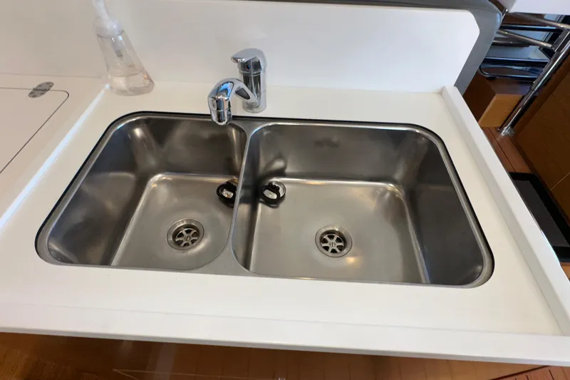 Slide: The Image of Stainless steel double sink in 2021 Beneteau Swift Trawler 41 Fly kitchen. - 33