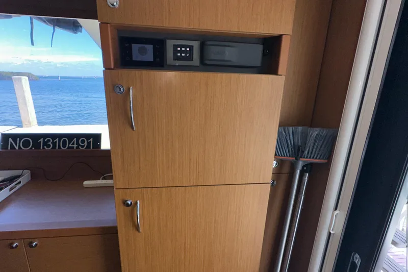 Slide: The Image of Interior of 2021 Beneteau Swift Trawler 41 Fly with wooden cabinetry and ocean view. - 36