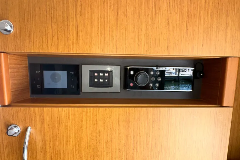 Slide: The Image of Control panel on 2021 Beneteau Swift Trawler 41 Fly, featuring modern navigation and audio systems. - 37