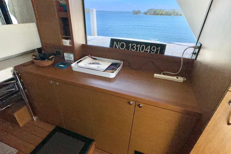 Slide: The Image of Interior of 2021 Beneteau Swift Trawler 41 Fly with ocean view through window. - 38