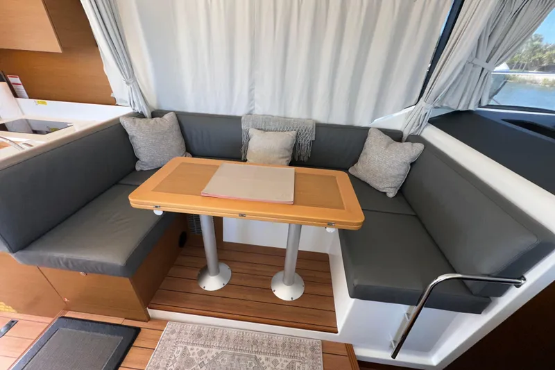 Slide: The Image of Interior of 2021 Beneteau Swift Trawler 41 Fly with cozy seating and table. - 40