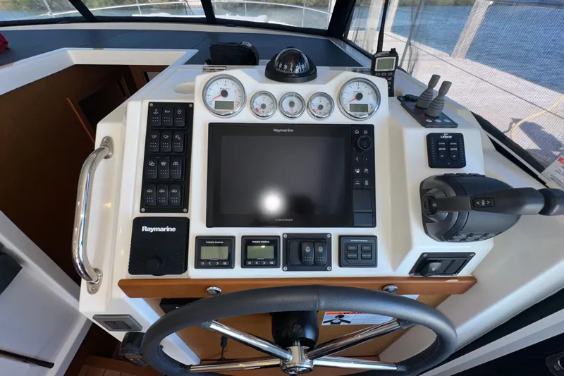 Slide: The Image of Helm of 2021 Beneteau Swift Trawler 41 Fly with Raymarine navigation system. - 42