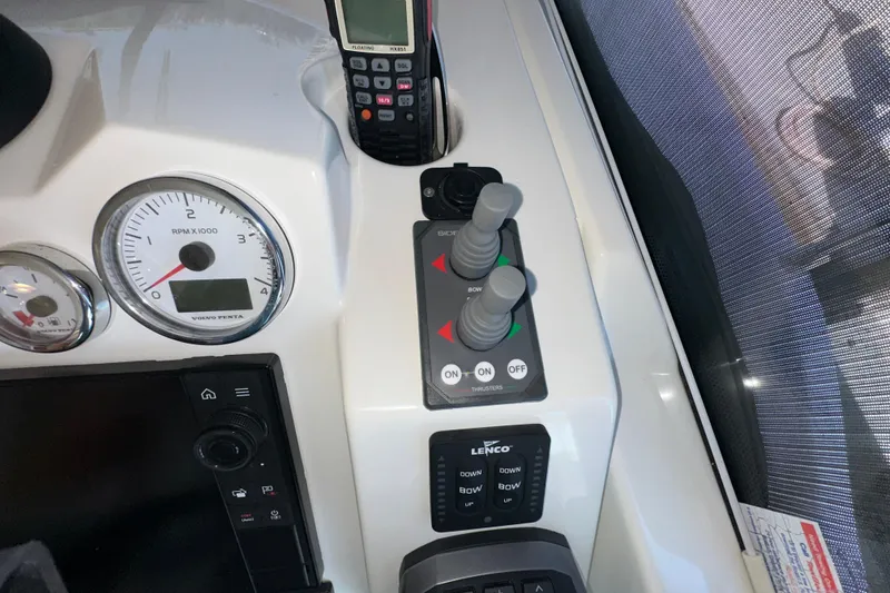 Slide: The Image of Control panel of 2021 Beneteau Swift Trawler 41 Fly with gauges and joystick controls. - 45