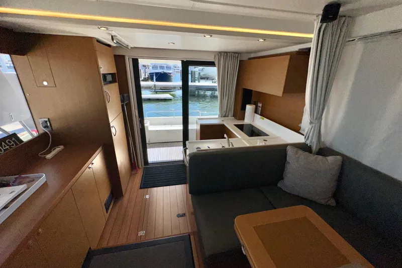 Slide: The Image of Interior of 2021 Beneteau Swift Trawler 41 Fly, featuring modern design and waterfront view. - 46