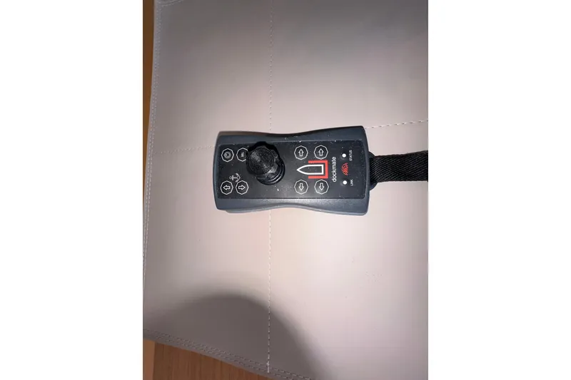 Slide: The Image of Remote control for 2021 Beneteau Swift Trawler 41 Fly, featuring joystick and directional buttons. - 48